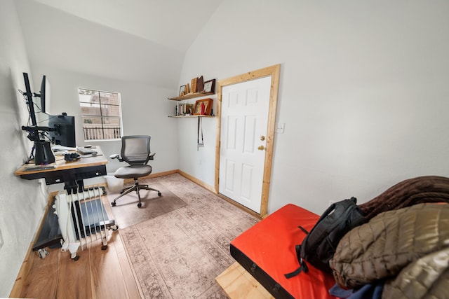 office area with lofted ceiling and light hardwood / wood-style flooring