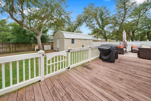 deck with an outdoor living space, a lawn, a grill, and a shed