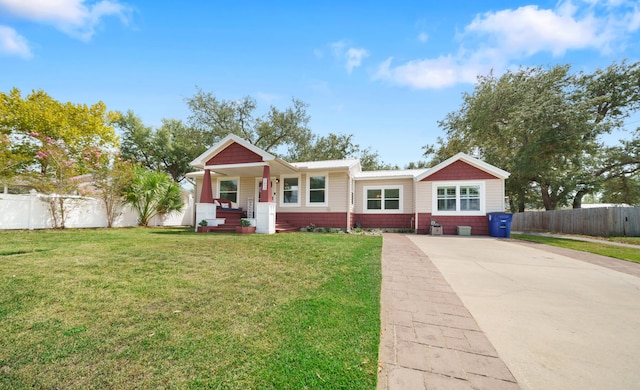 ranch-style house featuring a front lawn