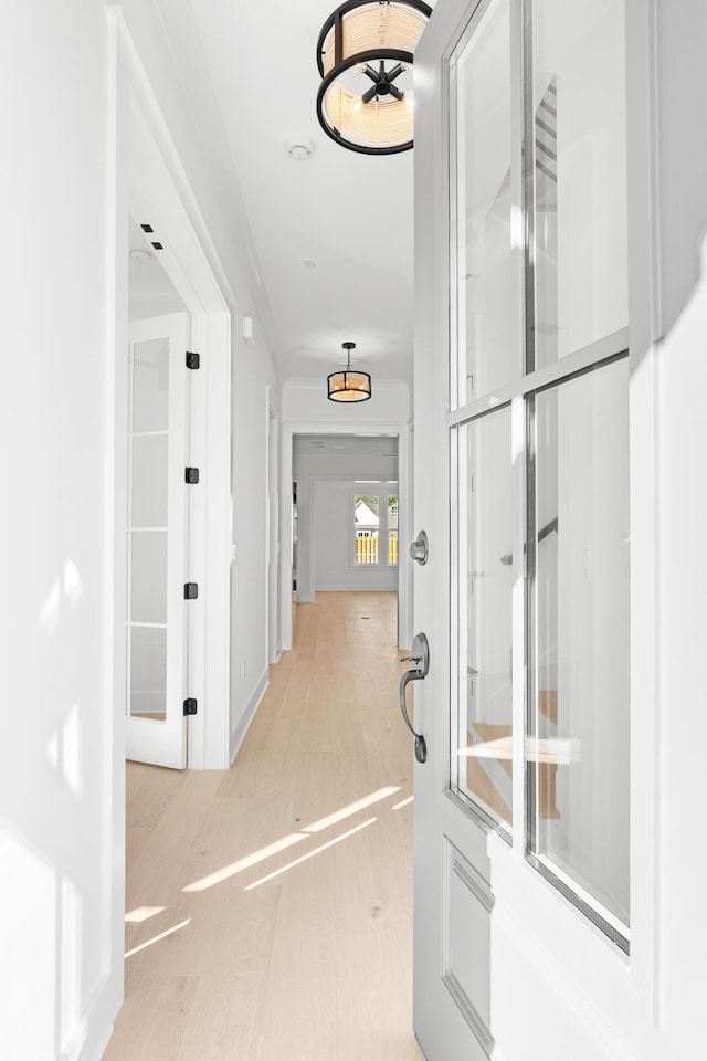 corridor featuring light hardwood / wood-style floors