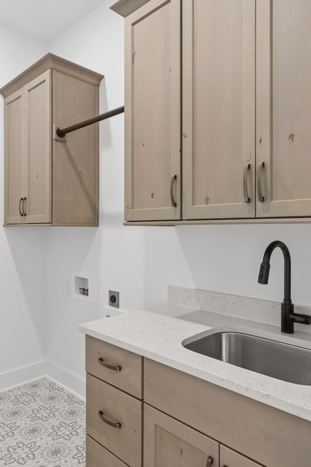 laundry area with electric dryer hookup, cabinets, sink, and hookup for a washing machine