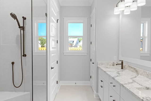 bathroom featuring a notable chandelier and vanity