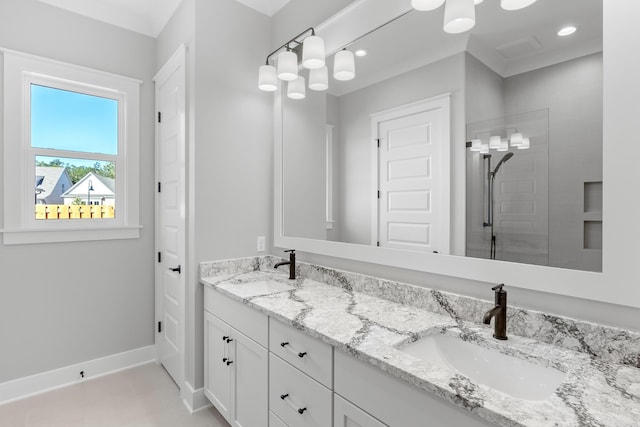 bathroom with tile patterned flooring, vanity, and walk in shower