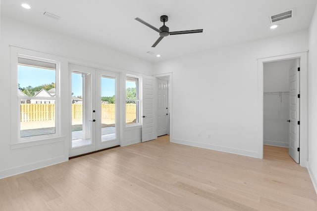 interior space featuring ceiling fan, french doors, and light hardwood / wood-style floors