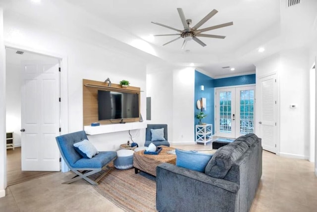 living room featuring ceiling fan, ornamental molding, and french doors