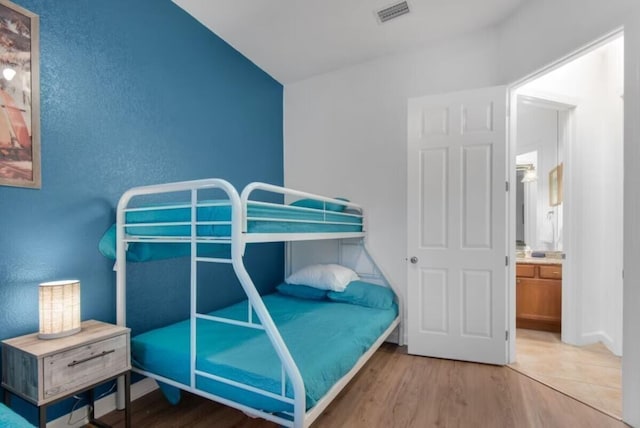 bedroom with hardwood / wood-style floors