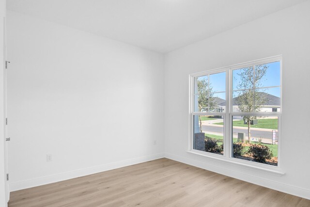 unfurnished room featuring light wood-type flooring