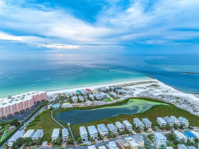 bird's eye view with a view of the beach and a water view