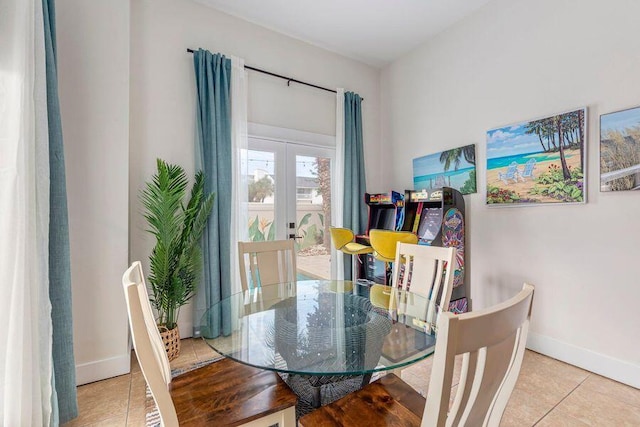 dining area with light tile patterned floors and french doors