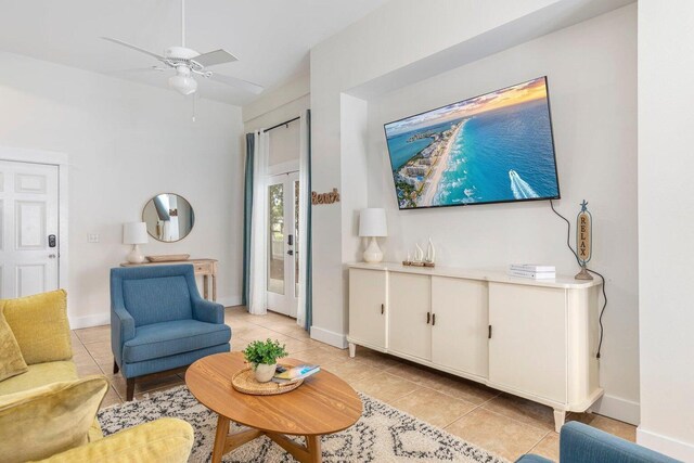 tiled living room featuring ceiling fan