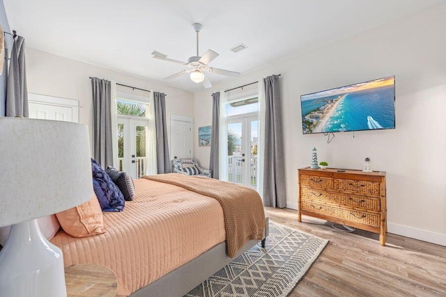 bedroom with light wood-type flooring, access to exterior, and french doors