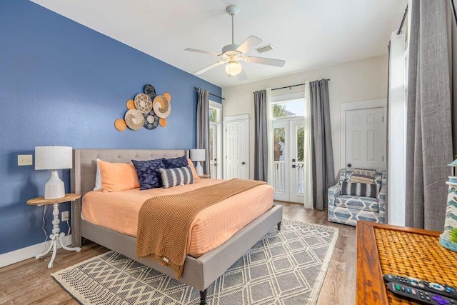 bedroom featuring wood-type flooring, access to exterior, and ceiling fan