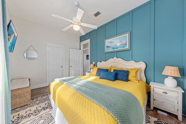 bedroom featuring ceiling fan and hardwood / wood-style flooring