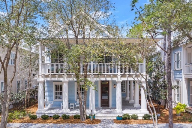 view of front of home featuring a balcony and a porch