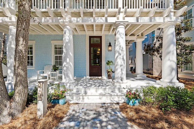 property entrance featuring covered porch