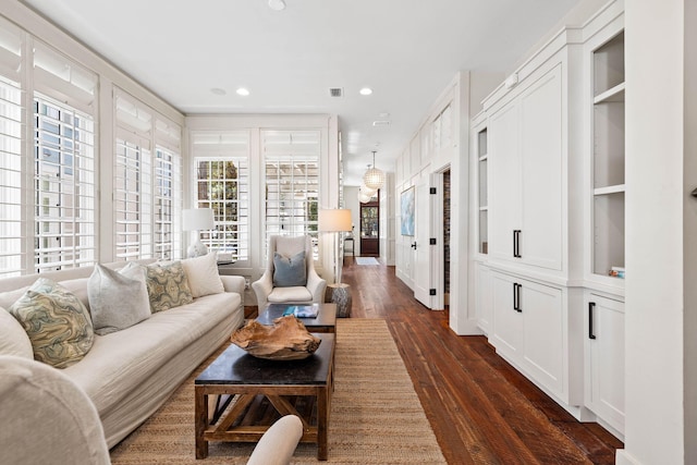 living room with dark hardwood / wood-style flooring