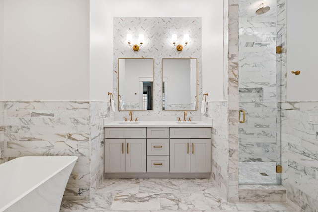 bathroom with independent shower and bath, vanity, and tile walls