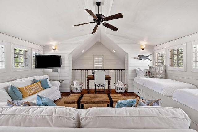 living room featuring lofted ceiling, dark hardwood / wood-style flooring, and ceiling fan