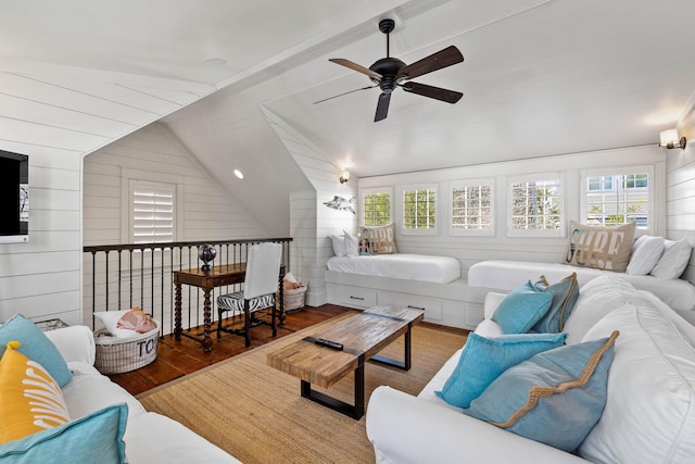 living room featuring a wealth of natural light, dark wood-type flooring, and vaulted ceiling