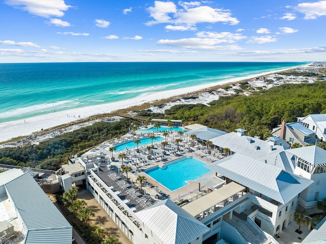 drone / aerial view with a beach view and a water view