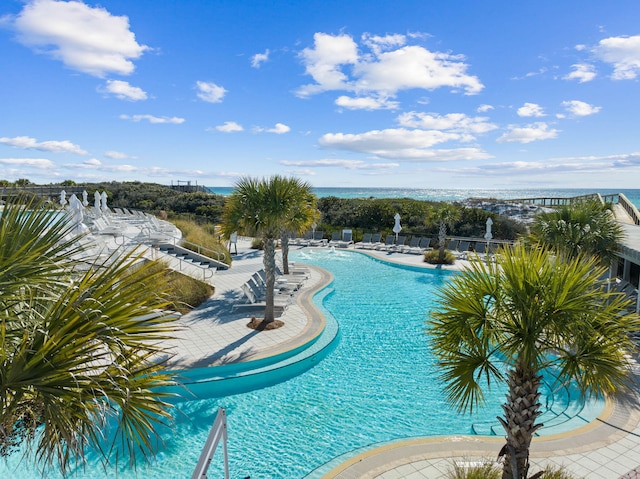 view of swimming pool featuring a water view