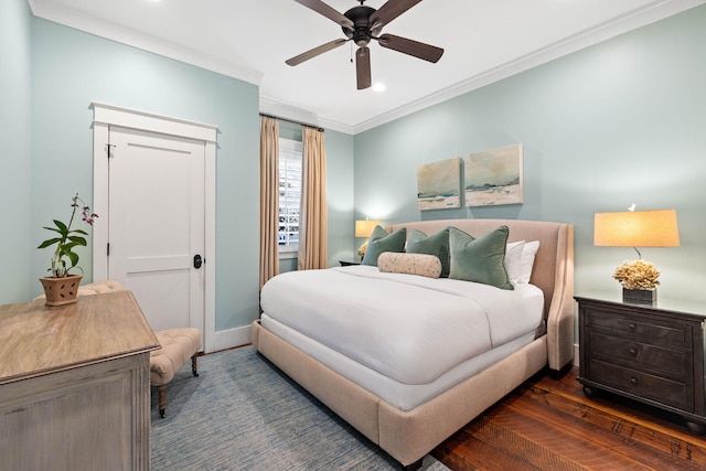 bedroom with crown molding, dark hardwood / wood-style floors, and ceiling fan