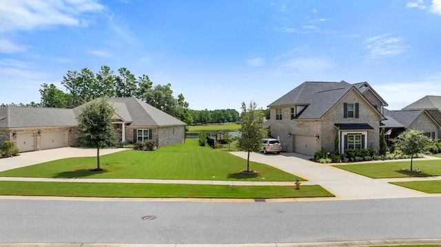 french country inspired facade featuring an attached garage, concrete driveway, and a front lawn