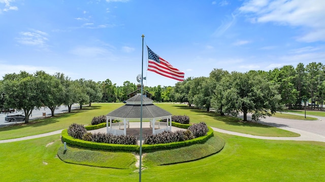 view of property's community featuring a gazebo and a lawn