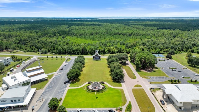 birds eye view of property with a wooded view