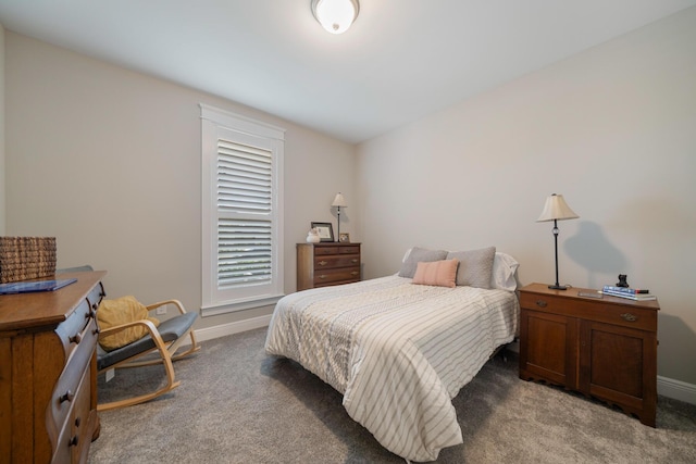 carpeted bedroom with baseboards