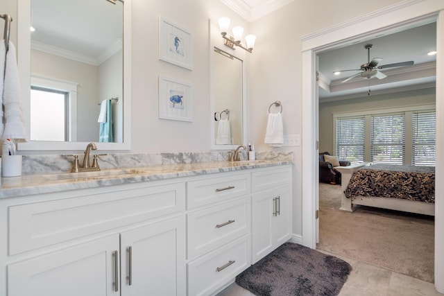 ensuite bathroom featuring a sink, double vanity, ornamental molding, and ensuite bathroom