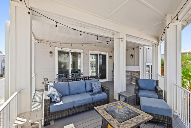 sunroom featuring track lighting and a wealth of natural light