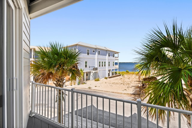 balcony featuring a water view