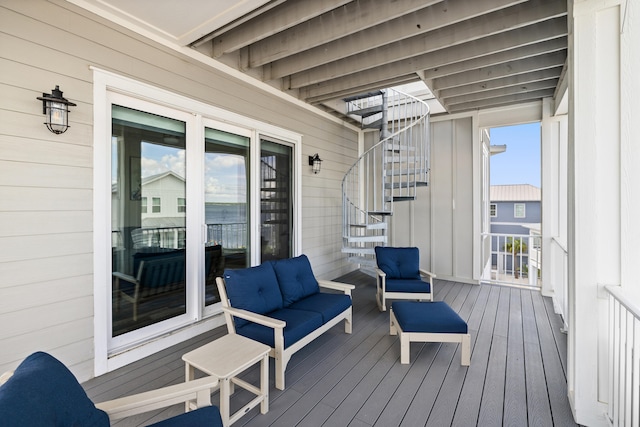 wooden terrace featuring an outdoor living space