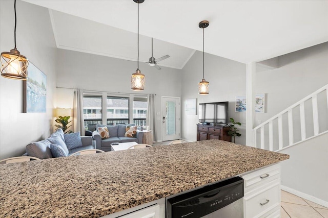 kitchen featuring ceiling fan, decorative light fixtures, high vaulted ceiling, and white cabinetry