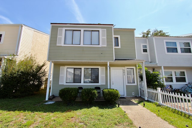 view of property featuring a front yard