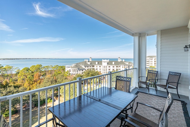 balcony featuring a water view