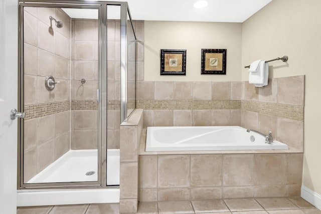 bathroom with plus walk in shower and tile patterned flooring