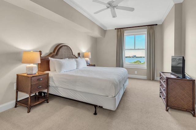 bedroom featuring ceiling fan, light carpet, and ornamental molding