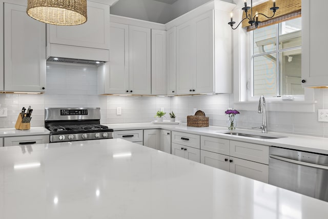 kitchen featuring white cabinetry, tasteful backsplash, stainless steel appliances, and sink