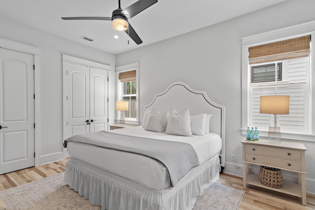 bedroom featuring light hardwood / wood-style flooring and ceiling fan