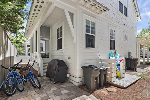 view of side of home with a patio area