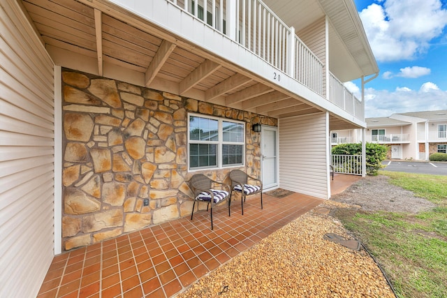 view of patio featuring a balcony