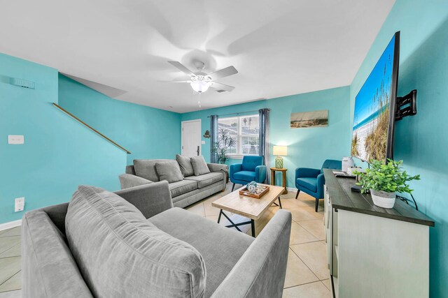 tiled living room featuring ceiling fan