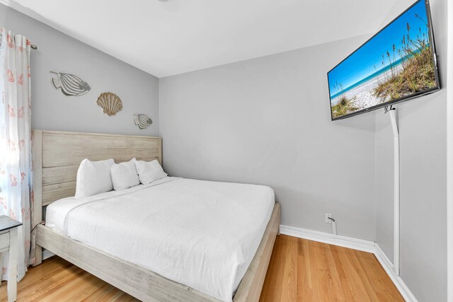 bedroom with light hardwood / wood-style flooring