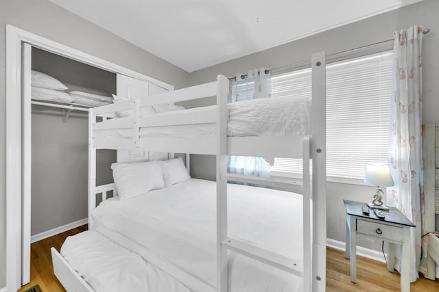 bedroom featuring a closet and hardwood / wood-style floors