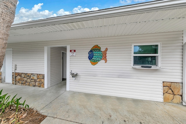 property entrance with a patio area