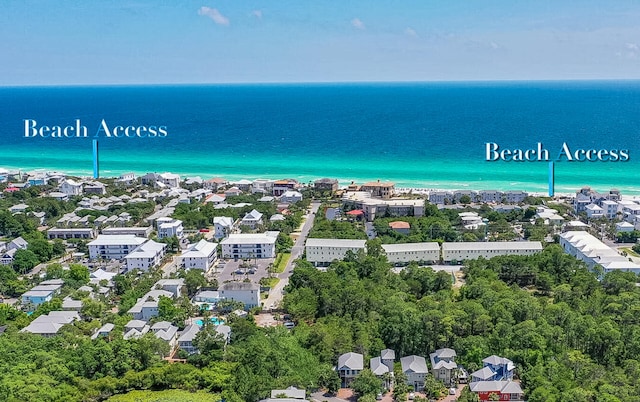 drone / aerial view with a residential view and a water view