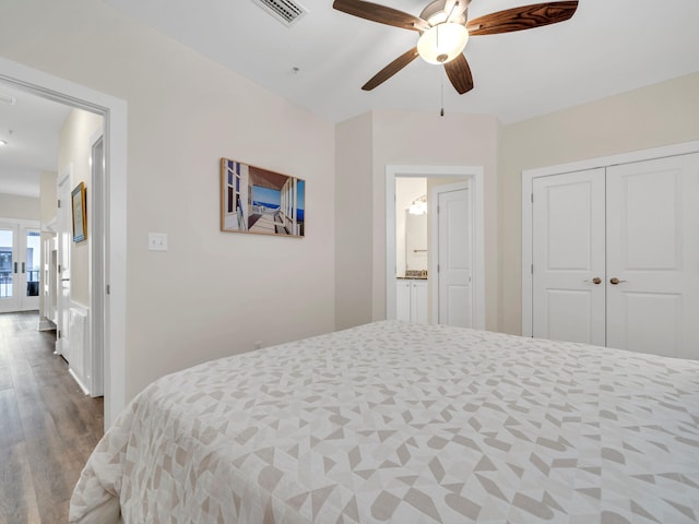 bedroom with visible vents, a ceiling fan, wood finished floors, french doors, and a closet