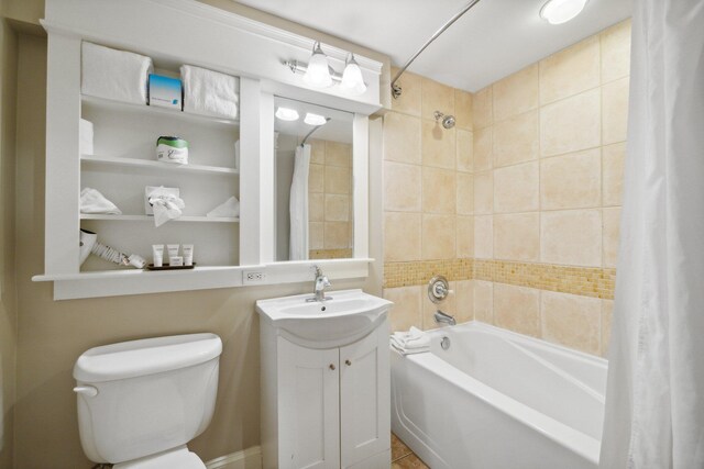 full bathroom featuring vanity, shower / tub combo, and toilet